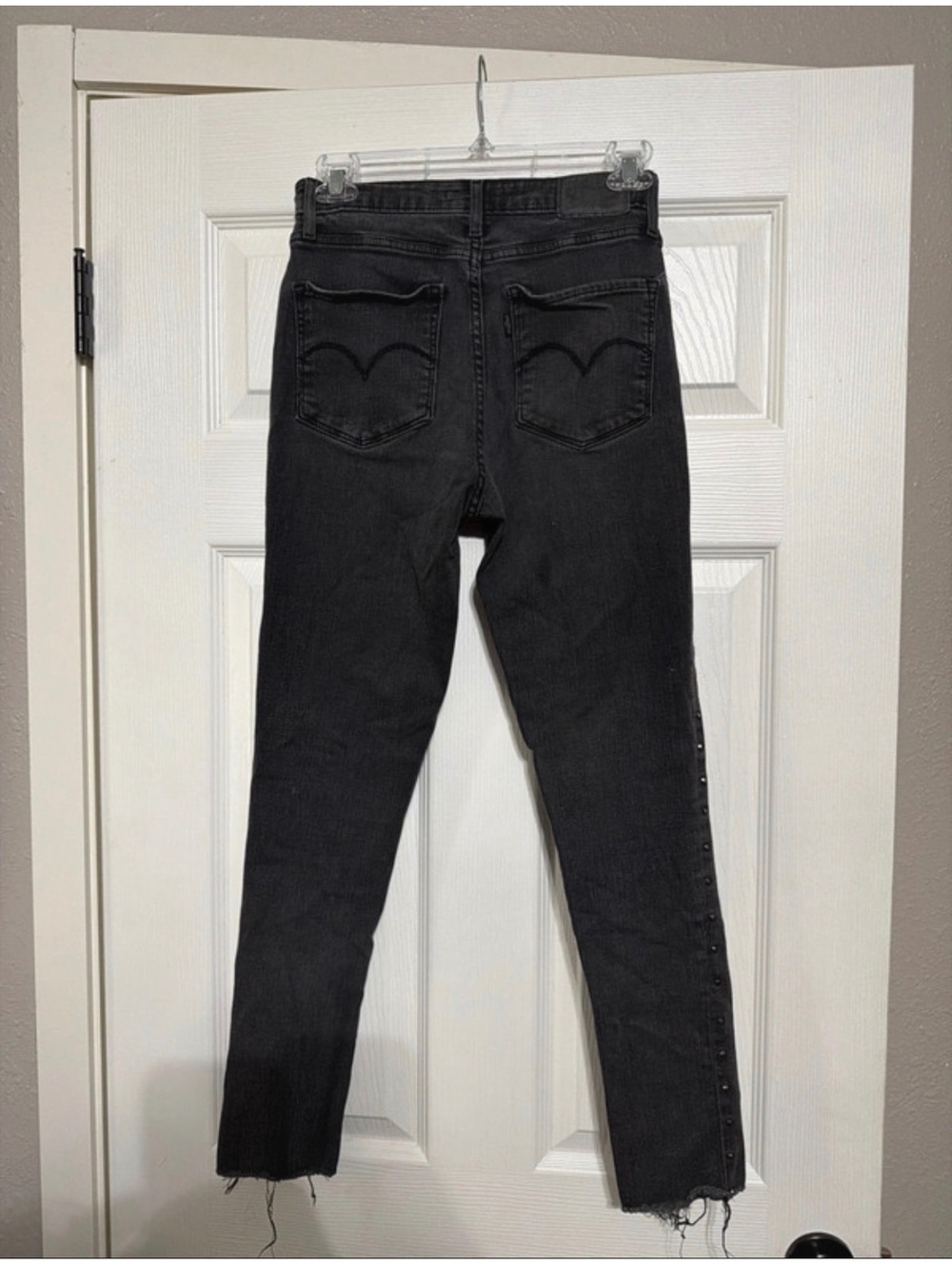 Levi's Black High-Waisted Skinny Jeans with Side Stud Detailing and Raw Hem
